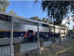 Several people board Amtrak Train # 547 at Davis, many of which are college students who attend UC Davis.